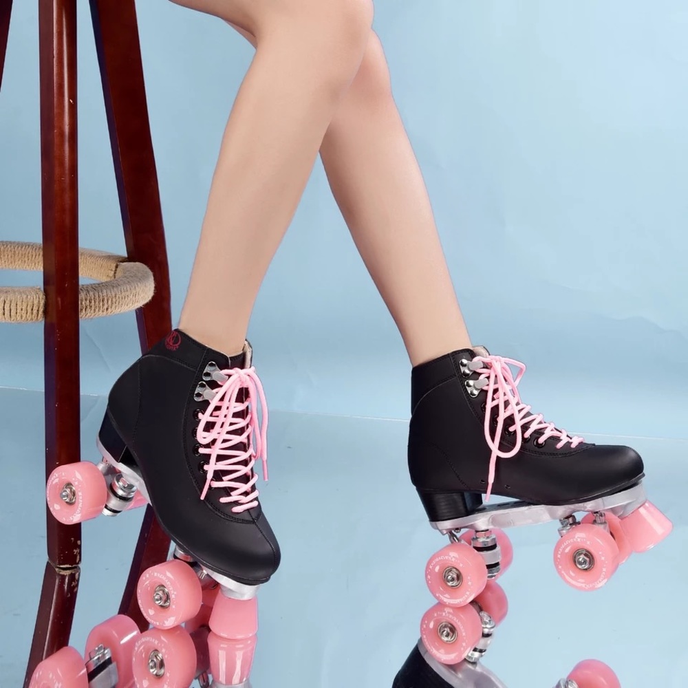 Worn once! black roller skates with pink wheels